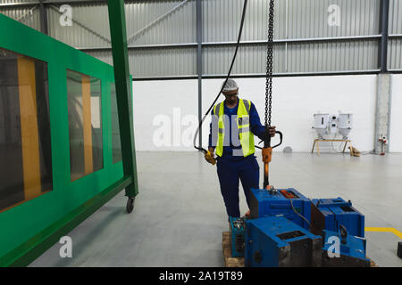 Male factory worker in a factory warehouse Stock Photo