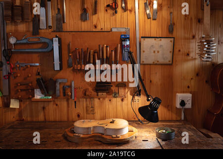 Violin being made in a workshop Stock Photo