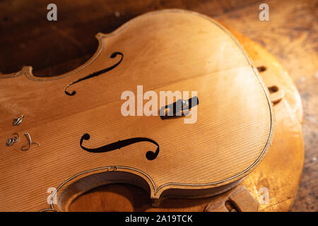 Violin being made in a workshop Stock Photo