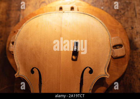 Violin being made in a workshop Stock Photo