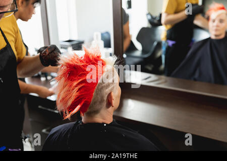 Modern bright beauty salon. Hair salon interior business with industrial  minimal look. Black and white decoration with mirrors, chairs,tv screen and  m Stock Photo - Alamy