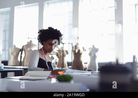 Female student working on a project at a fashion college Stock Photo