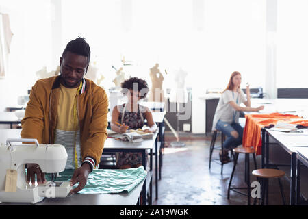 Young students working on projects at a fashion college Stock Photo