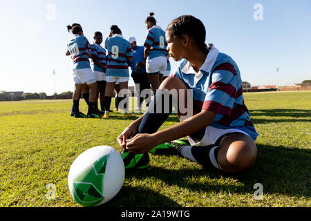Young adult female rugby player on a rugby pitch Stock Photo