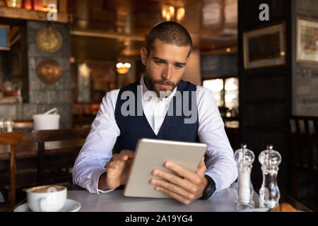 Young professional man in a cafe Stock Photo