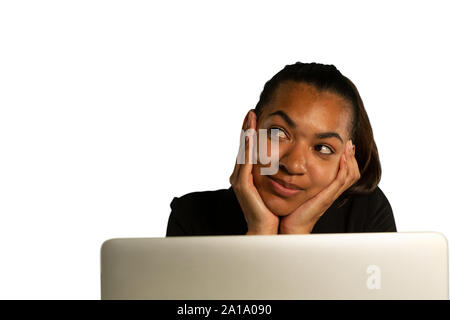 Young smiling businesswoman using a laptop Stock Photo