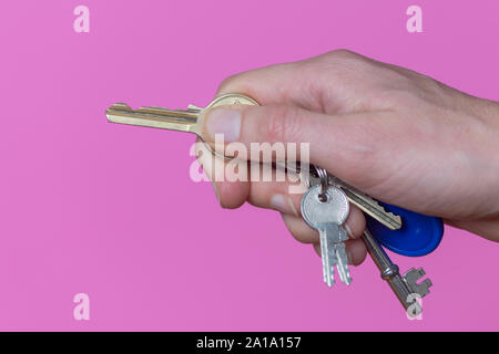 hand holding a house key Stock Photo