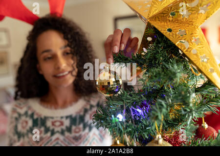 Woman at home at Christmas time Stock Photo
