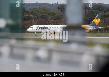 Duesseldorf, Germany. 25th Sep, 2019. A Condor aircraft lands at Düsseldorf Airport. The holiday airline Condor, a subsidiary of the insolvent British travel group Thomas Cook, had received the promise on Tuesday evening of a state bridging loan of 380 million euros. Credit: Marcel Kusch/dpa/Alamy Live News Stock Photo