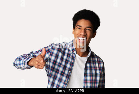 Hey you! Cheerful black guy indicating happily at camera Stock Photo