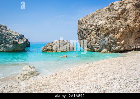 Megali Petra (big rock) beach in Lefkada ionian island in Greece. Beautiful beach with crystal clear turquoise water. Stock Photo