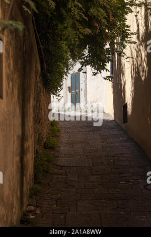 Narrow, hilly, winding street. Florence, Toscana 50125, Italy Stock Photo