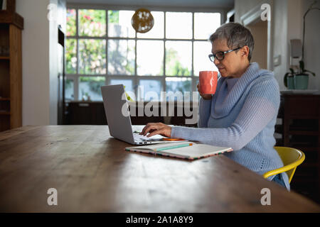 Mature woman alone at home Stock Photo