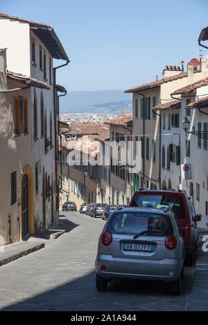 Narrow, hilly, winding street. Florence, Toscana 50125, Italy Stock Photo