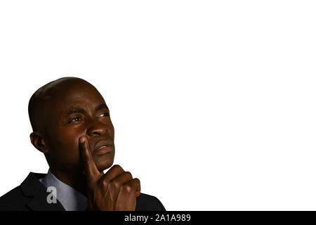 Businessman thinking and looking up Stock Photo