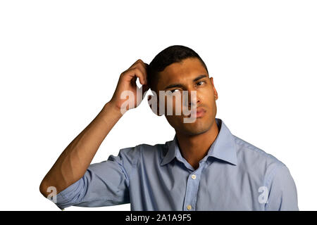 Young confused businessman scratching his head Stock Photo