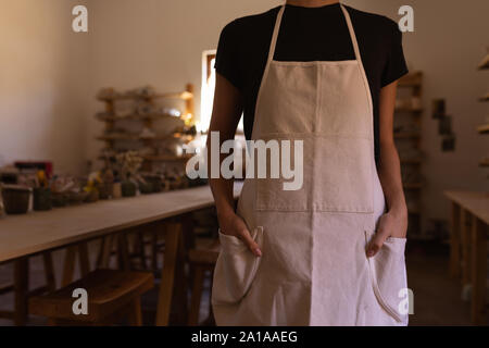 Female potter in a pottery studio Stock Photo