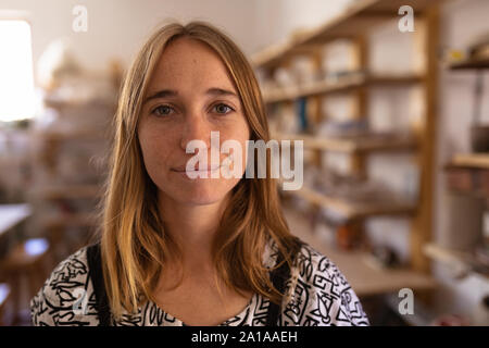 Portrait of female potter in a pottery studio Stock Photo