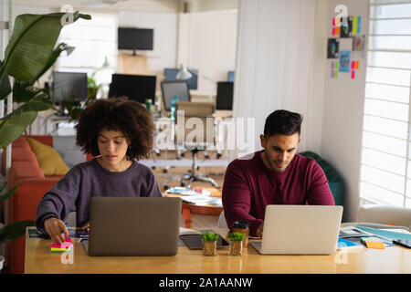 Young business creatives working together in an office Stock Photo