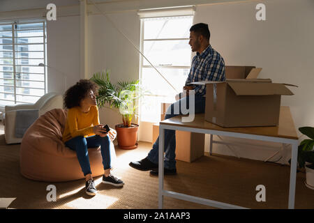 Young business creatives moving into an office Stock Photo