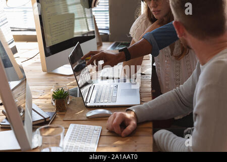 Young creative professionals working in an office Stock Photo