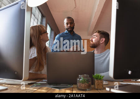 Young creative professionals working in an office Stock Photo