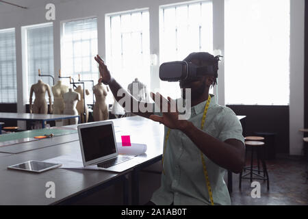 Male student using VR at a fashion college Stock Photo