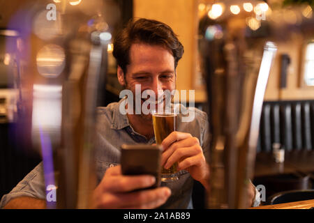 Young man in a bar Stock Photo