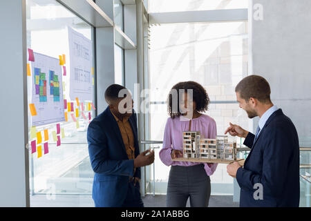 Three young architects working together Stock Photo