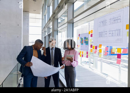 Diverse young architect team working in modern office Stock Photo