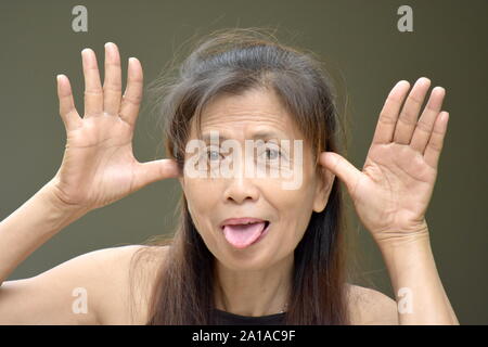 A Woman Making Funny Faces Stock Photo