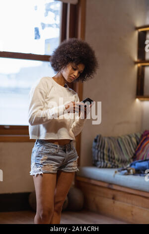 Young woman using smartphone Stock Photo