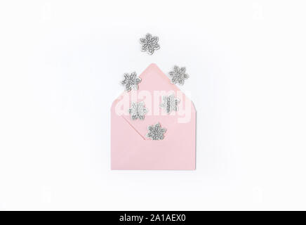 Pink envelope with snowflakes isolated on white background Stock Photo