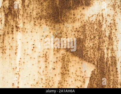 rusty texture old metal surface painted beige paint with rust Stock Photo