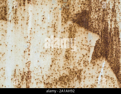 rusty texture old metal surface painted beige paint with rust Stock Photo