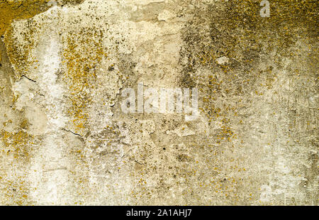 rusty texture old concrete wall with remnants of plaster Stock Photo