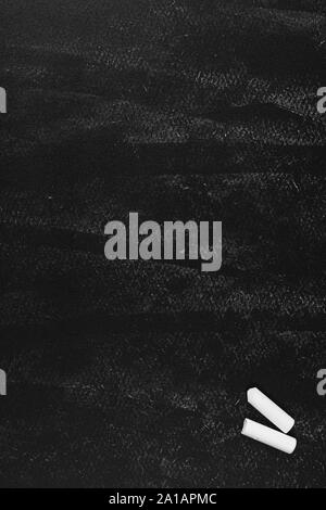 Black chalk board with white chalk background. Grunge empty blackboard or Chalkboard texture vertical. Stock Photo