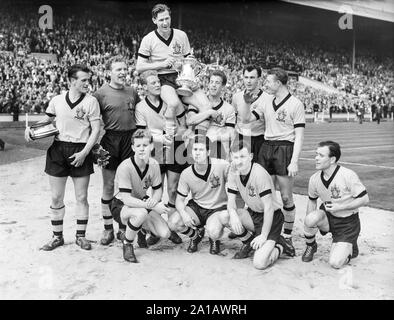 The victorious Wolverhampton Wanderers Football Club from England, at Wembley Stadium on 7th May 1960, having just won the FA Cup by beating Blackburn Rovers. The Wolves Captain Bill Slater holds the cup, surrounded by his team mates. Stock Photo