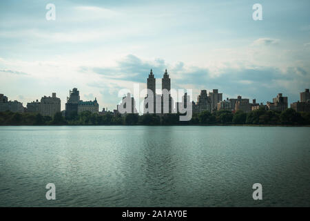 Central Park Lake and Upper West Side skyline, New York City, USA