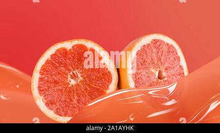 Slices of juicy grapefruit on red background Stock Photo