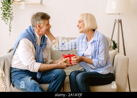 Loving husband making birthday surprise to wife Stock Photo