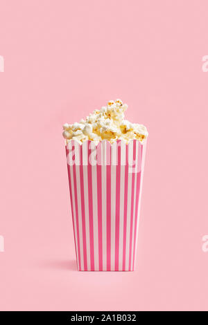 Popcorn in buckets on a pink background Stock Photo