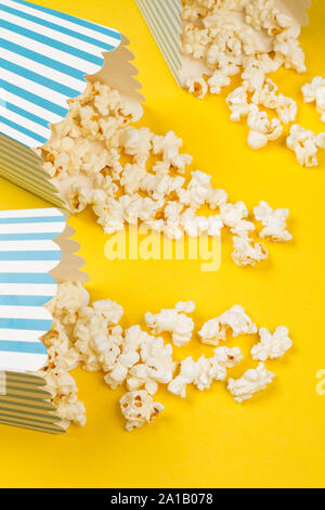 Popcorn in buckets on a yellow background Stock Photo