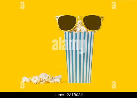 Popcorn in buckets on a yellow background Stock Photo