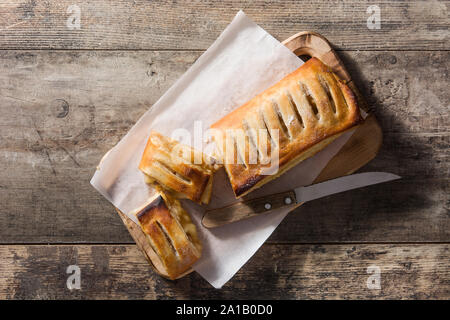 Traditional homemade apple strudel on wooden table. Top view Stock Photo