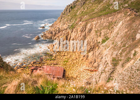 Wreckage of the shipwrecked ship the RMS Mulheim at the base of the cliffs at Castle Zawn near Land's End, Cornwall, England. UK. Stock Photo