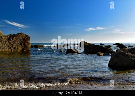 Evening low tide on Porth Ysgo beach. Stock Photo
