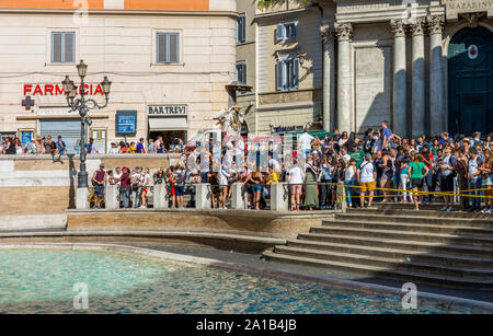 Rome, Italy - August 16, 2019: Tourists visiting the largest Trevi Fountain in Rome. Stock Photo