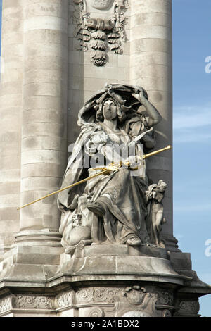 Sculpture on the Pont Alexandre 3 in Paris, expressive and subtle sculptural details. Victory figure with sword Stock Photo