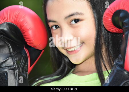 Diverse Female Athlete And Happiness Wearing Boxing Gloves Stock Photo